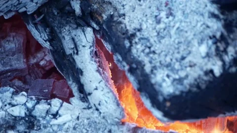Campfire 4k, Flames Dance on Glowing Wood Coals, Handshot Stock Footage 150599407
