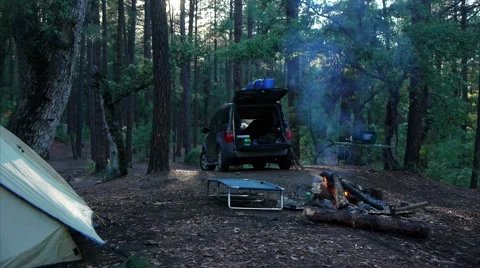 Campfire and SUV in Camping setting #2 Stock Footage 61120096