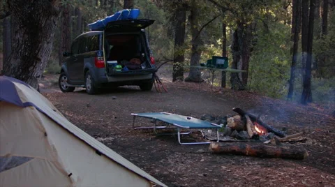 Campfire and SUV in Camping setting #7 Stock Footage 61122214