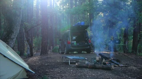 Campfire and SUV in Camping setting #1 Stock Footage 61130198