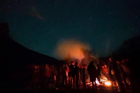 Campfire beneath the night sky Stock Photos