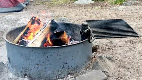 Campfire burning on a summer night camping with the family at the campground. Stock Footage 92394181