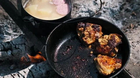 Campfire Cooked Chicken and Soup Stock Footage 303706791