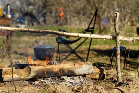 Campfire with a cooking pot Stock Photos