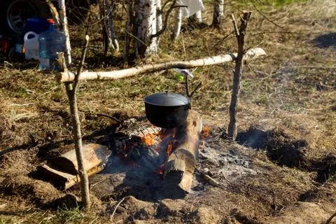 Campfire with a cooking pot Stock Photos