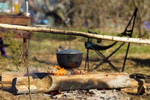Campfire with a cooking pot Stock Photos