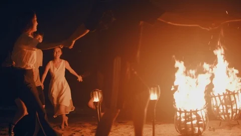 Campfire dance on the beach Stock Footage 125412057