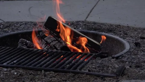 Campfire in Fire Pit with Steel Cooking Grate Stock Footage 278927716