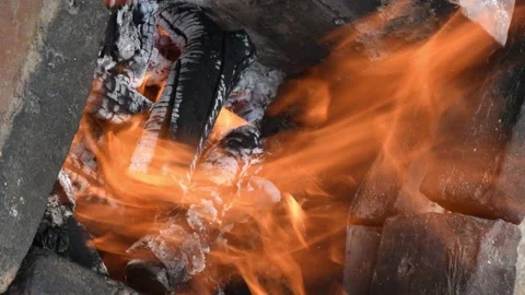 Campfire flaming in rustic fireplace outdoor in countryside Stock Footage 154451814