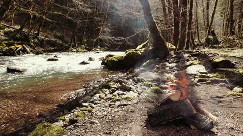 Campfire Next to a River Stock Footage 52330691