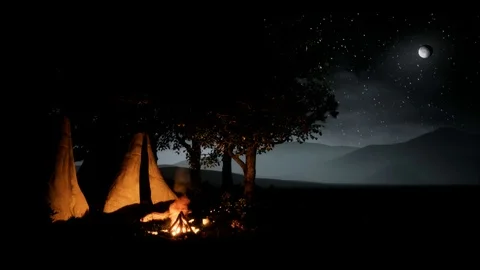 Campfire night time scene with mountains in the background Stock Footage 114056685