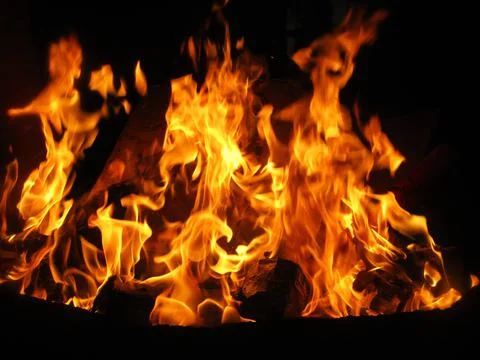 Campfire at nighttime Stock Photos