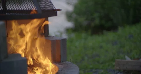 Campfire pit by the lake at evening / Side view / Slow motion 2 Stock Footage 130927668