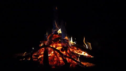 Campfire red hot coals with blue smoke on black background, 8x slow motion Stock Footage 86279557