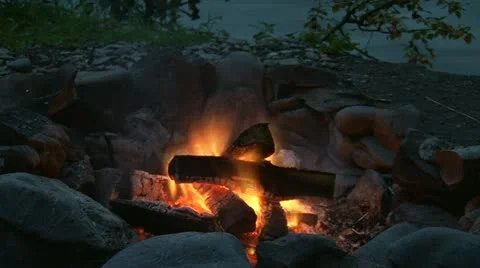Campfire by River Burns Down timelapse Stock Footage 11873949