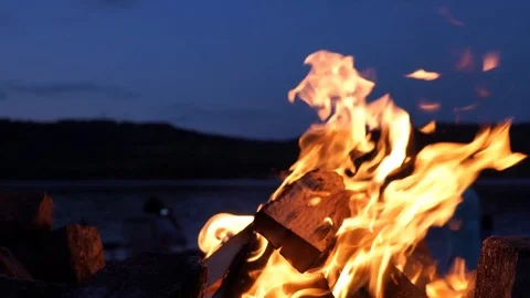 A campfire by the river at night Stock Footage 114631004