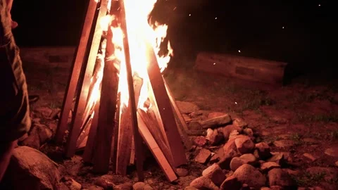 Campfire Setup at Night in Rustic Outdoor Setting with Glowing Flames 스톡 동영상 339201319