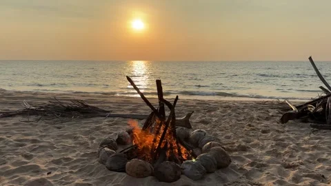 Campfire on the sunset at the tropical beach Stock Footage 277597443