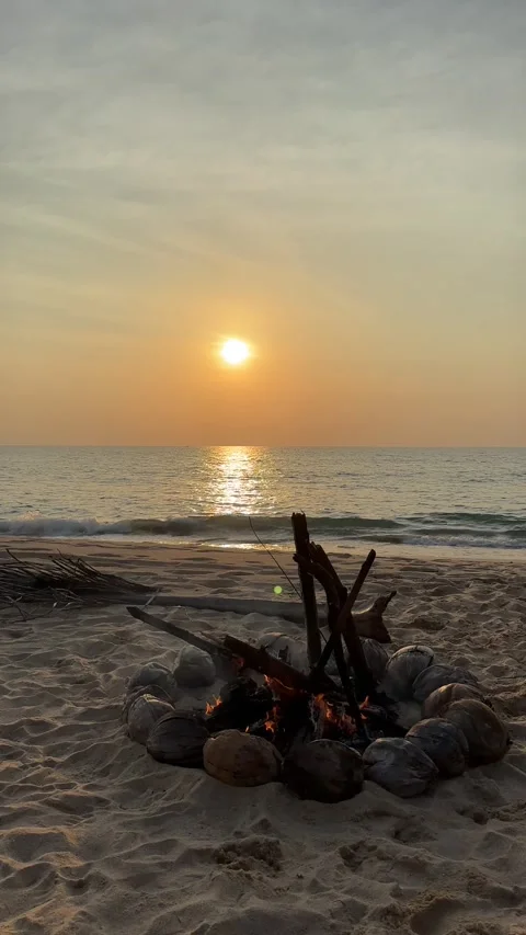 Campfire on the sunset at the tropical beach Stock Footage 277688289