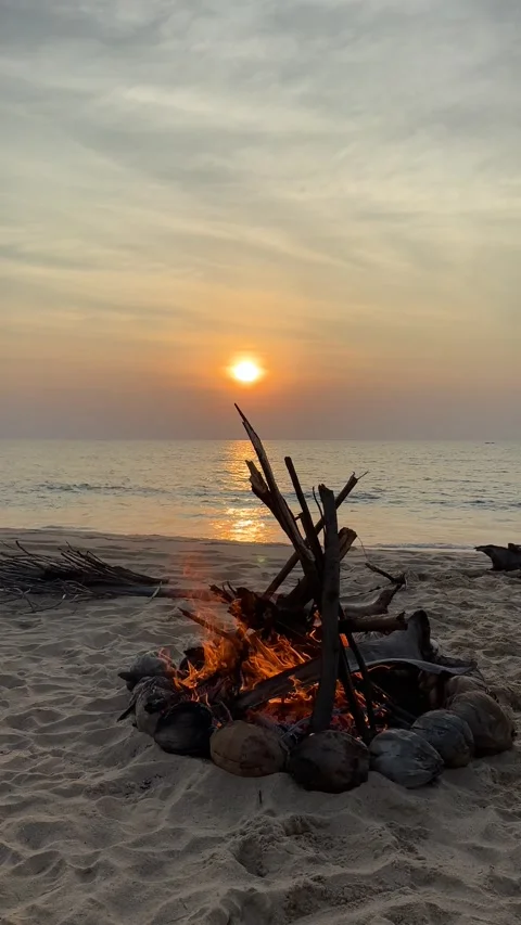 Campfire on the sunset at the tropical beach Stock Footage 277688587