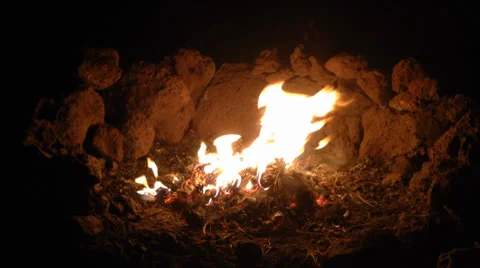 Campfire surrounded by lava rocks burning in the White Mountains 4 Stock Footage 39358597