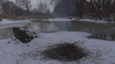 Campfire in winter scenery Stock Footage 148442118