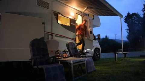 Campground RV and Tent Camping. Evening Relaxing on the Campsite. Stock Footage