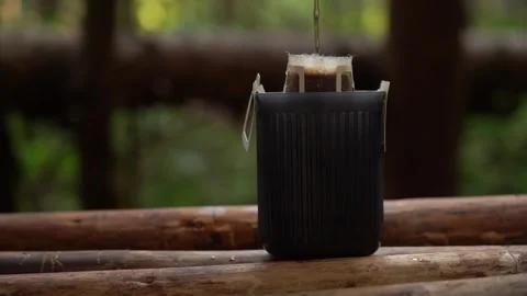 Camping coffee. Exploring the art of brewing coffee in the forest Stock Footage 315172392