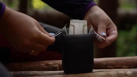 Camping coffee. Exploring the art of brewing coffee in the forest Stock-Footage 337175978