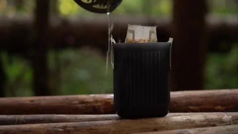 Camping coffee. Exploring the art of brewing coffee in the forest Video stock 341874124