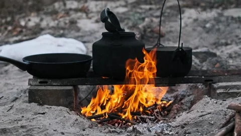Camping Cooking on Open Fire Stock Footage 284420982