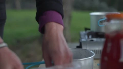 Camping Cooking Pasta for Dinner Handheld 4K Stock Footage 63920902
