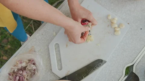 Camping cooking preparation. Preparing ingredients for campfire meal. Outdoor Stock Footage 332289108