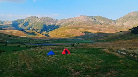 Camping in the fields of lentils and mountains on the background Video stock 128357284