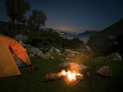 Camping with fire at night Stock Photos
