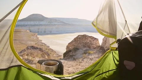 Camping first person point of view enjoy coffee and sunrise in Sor Tuzbair .. Stockbeeldmateriaal 280180047