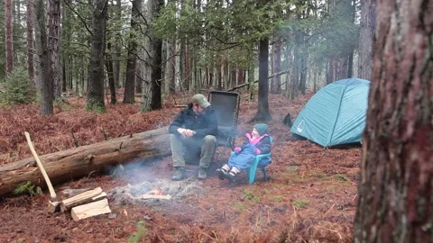 Camping in Forest by Campfire with Man and Girl Stock Footage 172264924