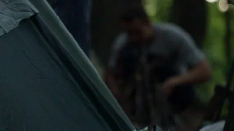 Camping in the forest.Man makes a fire Stock Footage 99982008