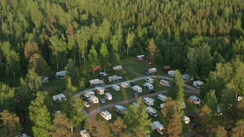 Camping ground in forest. Aerial drone view of caravan motor home camp site Video stock 139154909