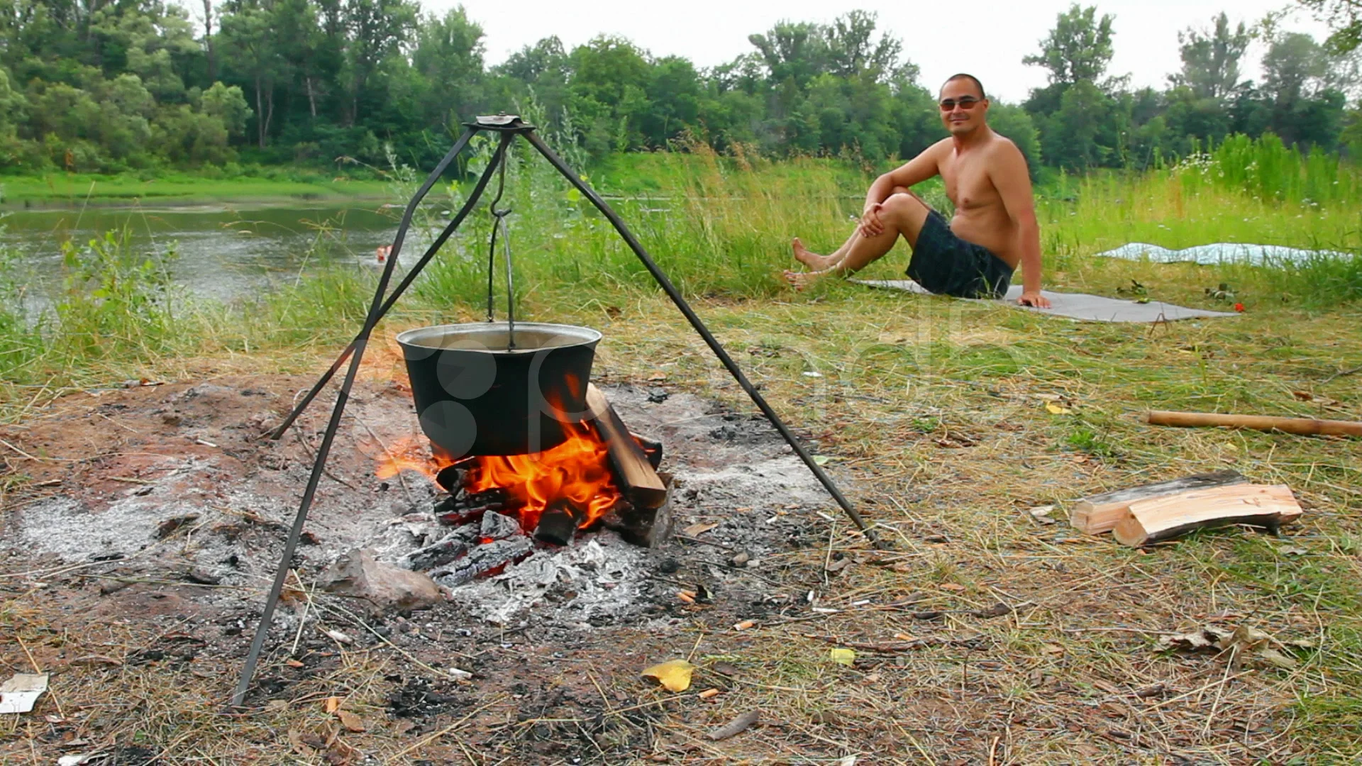 https://images.pond5.com/camping-kettle-over-campfire-footage-008651552_prevstill.jpeg