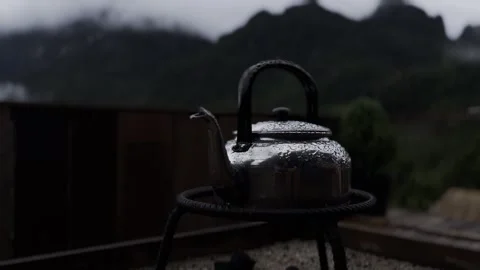 Camping Kettle with Water Drops and Mountain View Stock Footage 338372238