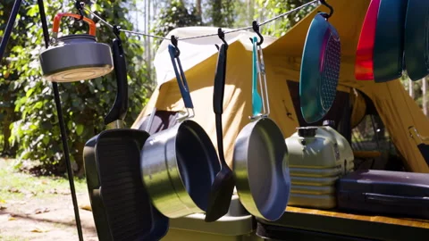 Camping kitchen tools hanging on the rail Stock Footage 168484733