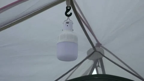 Camping lantern hanging in the tent Stock Footage 293115905