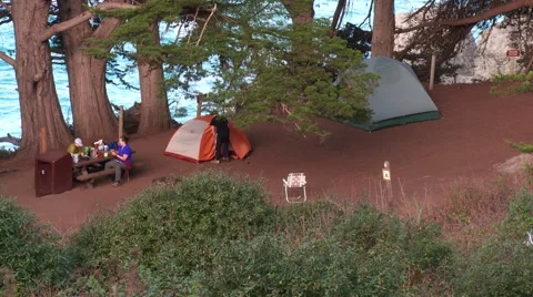 Camping, man exiting tent Stock Footage 43172791