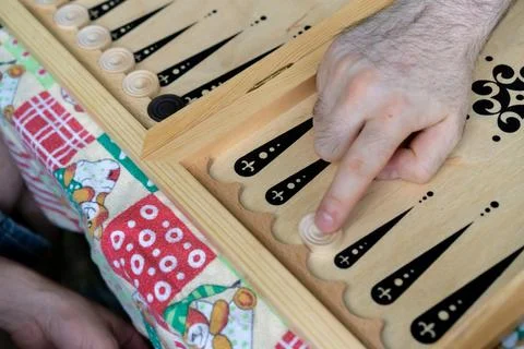 Camping, playing backgammon on the table Stock Photos