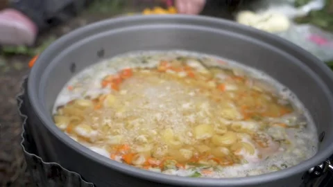 Camping pot boiling in slow motion Stock Footage 146239393
