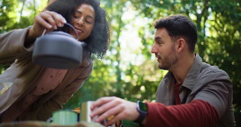 Camping, pouring and kettle with couple in nature for brewing coffee, trekking Stock Footage 316766822
