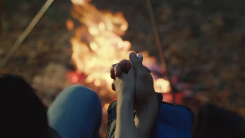 Camping romance. Unrecognizable couple in live holding hands and watching Stock Footage