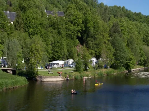 Camping at the Semois river in the Belgian Ardennes Stock Footage 76137377