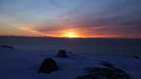 Camping on snow with sunset in background Stock Footage 143770083